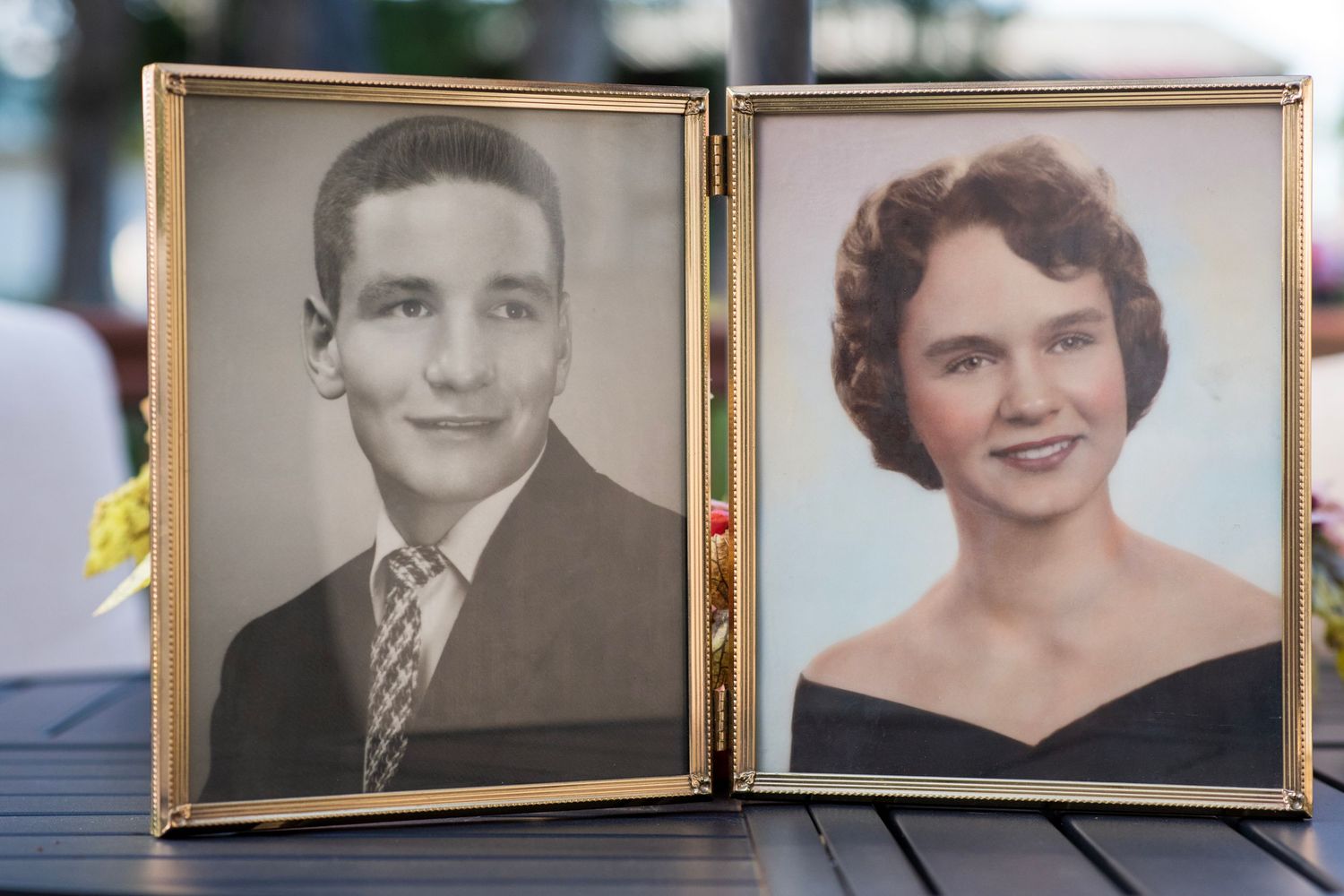 Vintage framed dual portrait photos of a young man in a suit and a young woman in formal attire, classic 1950s style.