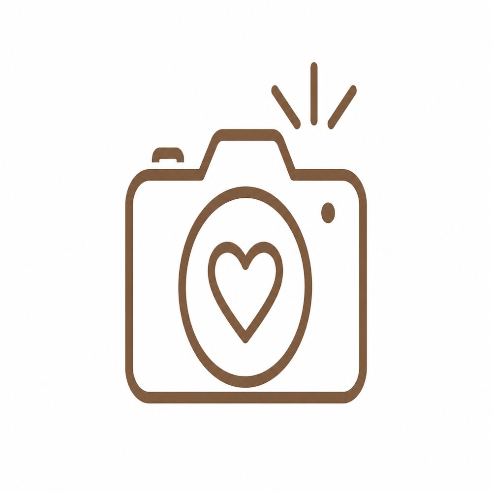 Brown line art icon of a camera with heart-shaped lens and flash symbol on white background.