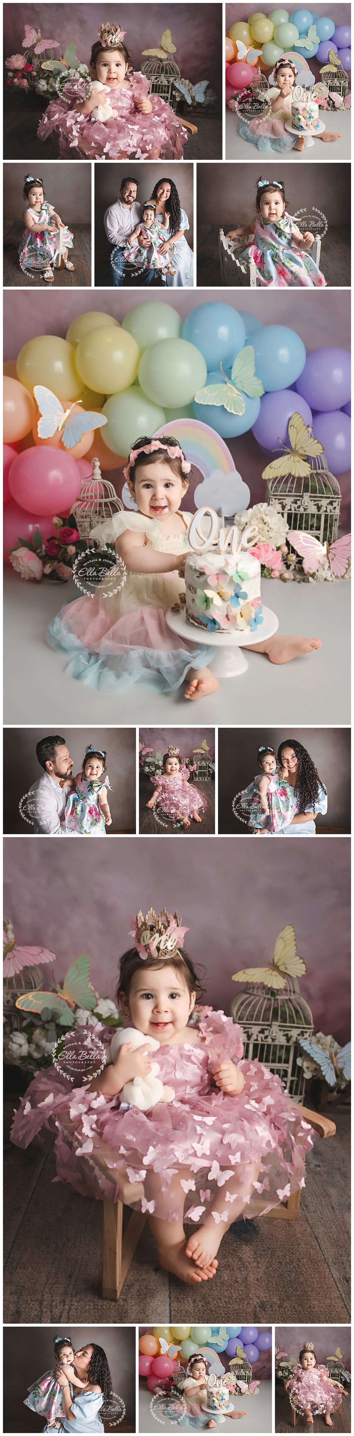 Baby girl in pink butterfly dress celebrates first birthday with rainbow balloons, cake smash, and family portraits.