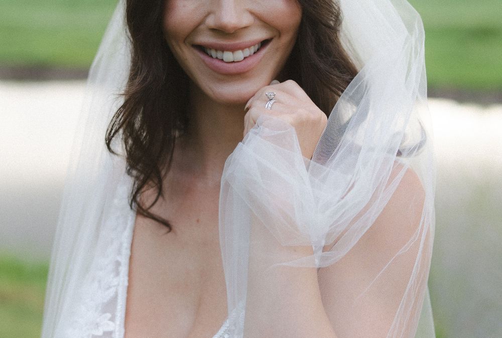 bride smiling with wedding ring before kauai elopement