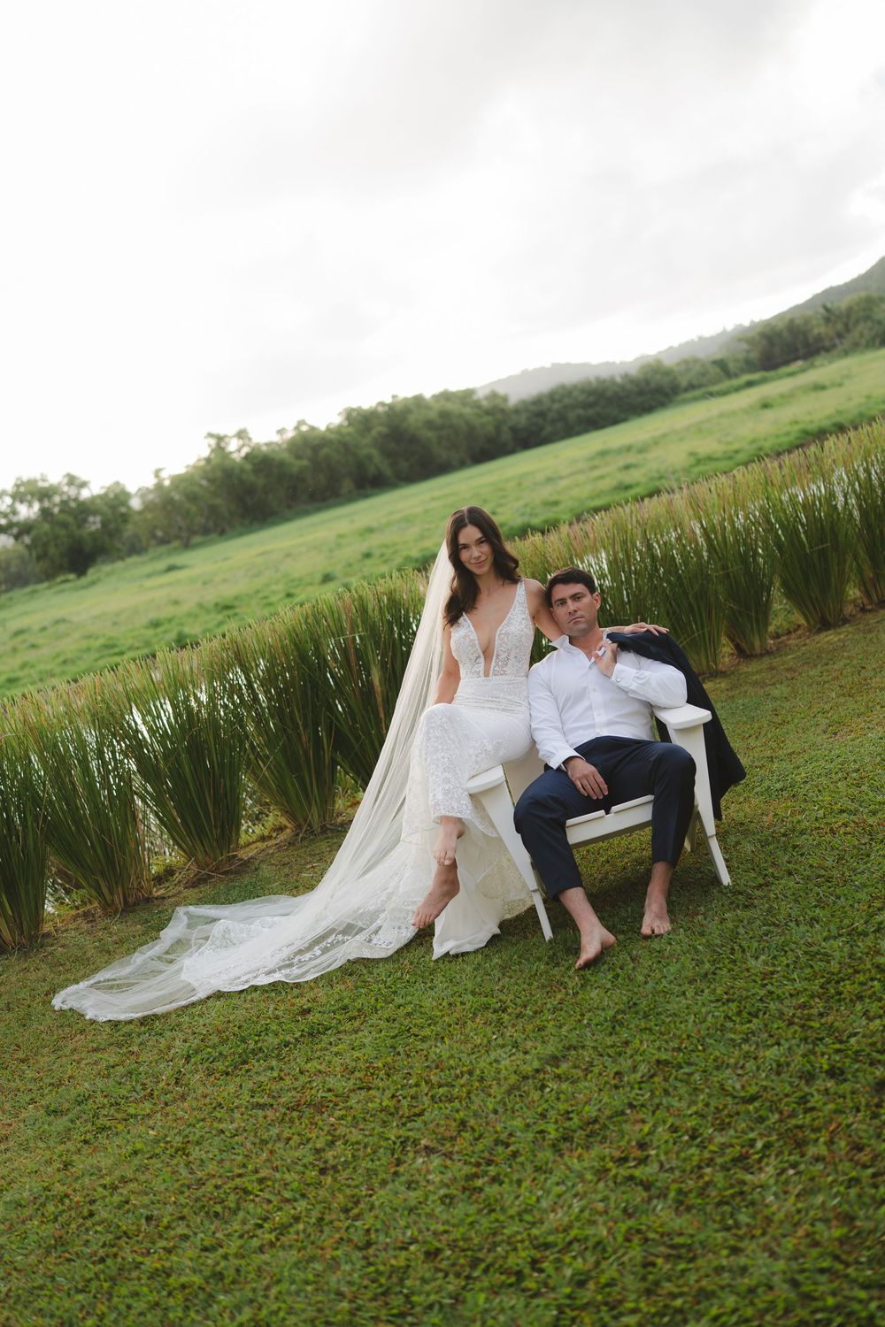 wedding couple posing by Hanalei River