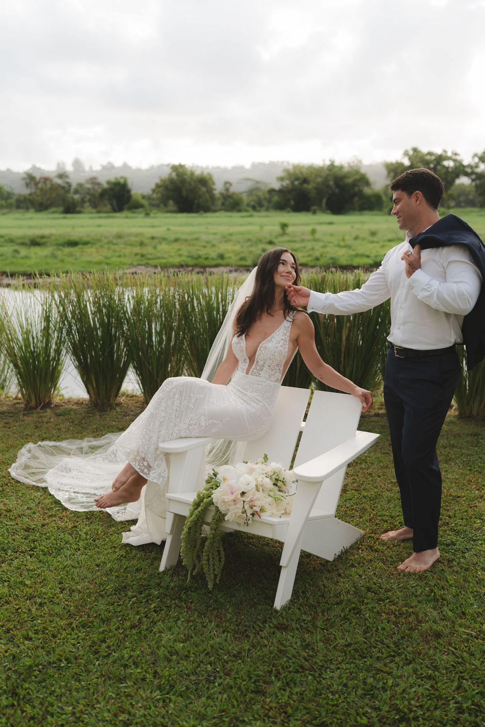 wedding couple posing by Hanalei River