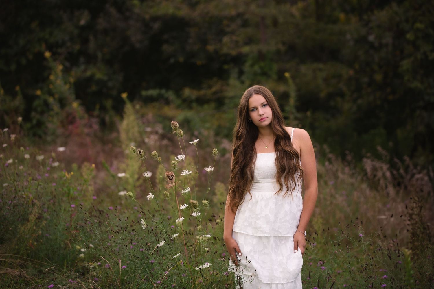 Senior girl outdoor portrait in wildflower field at golden hour at Island Lake in Brighton, Michigan by South Lyon, MI photographer