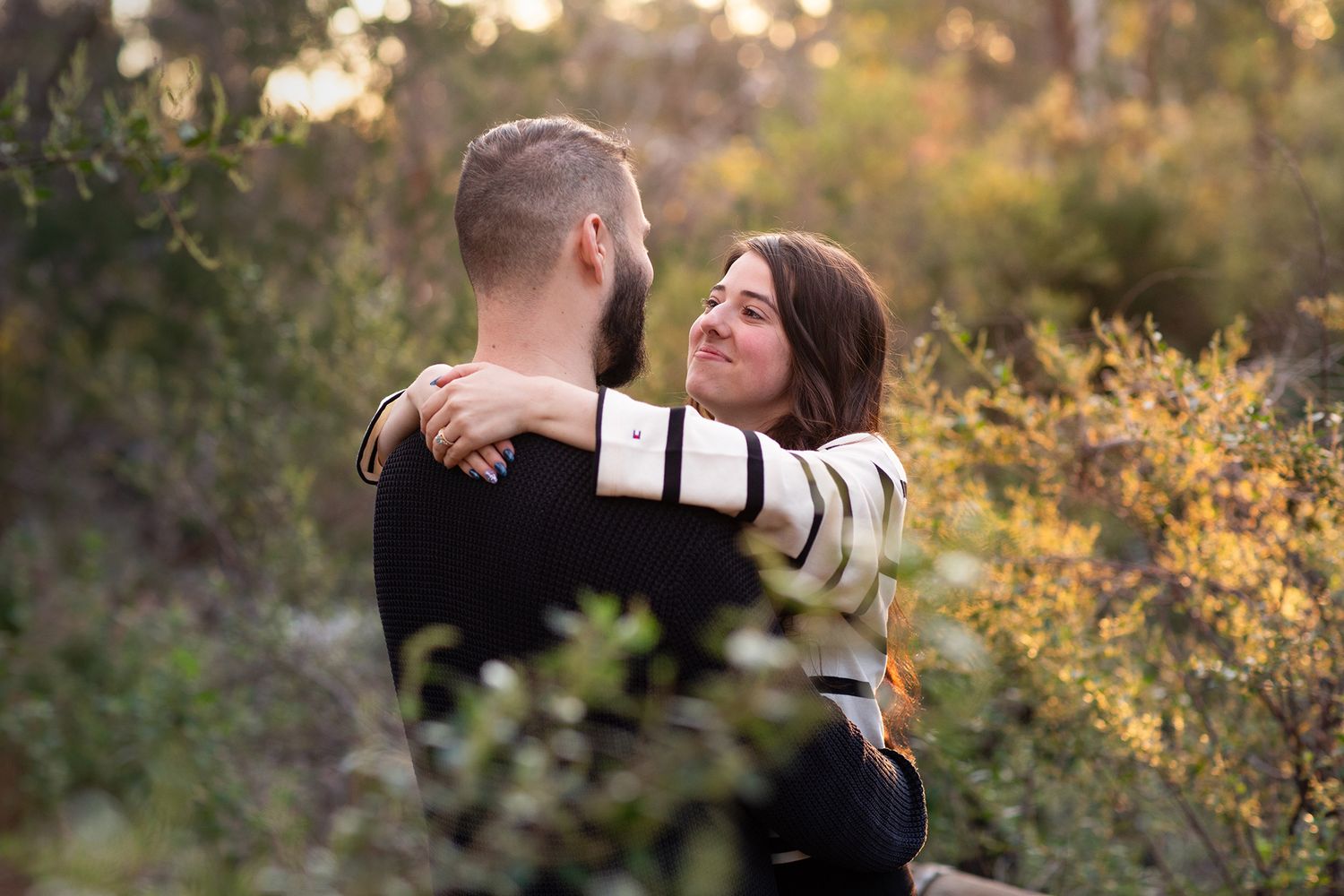 Couple looking into each others eyes after their surprise proposal photo session in Perth