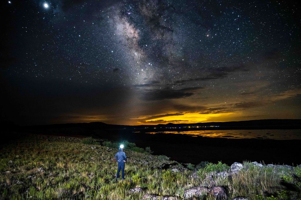 Chris Cornish, photographer, looking up at the milkyway in a self portrait taken in flagstaff arizona