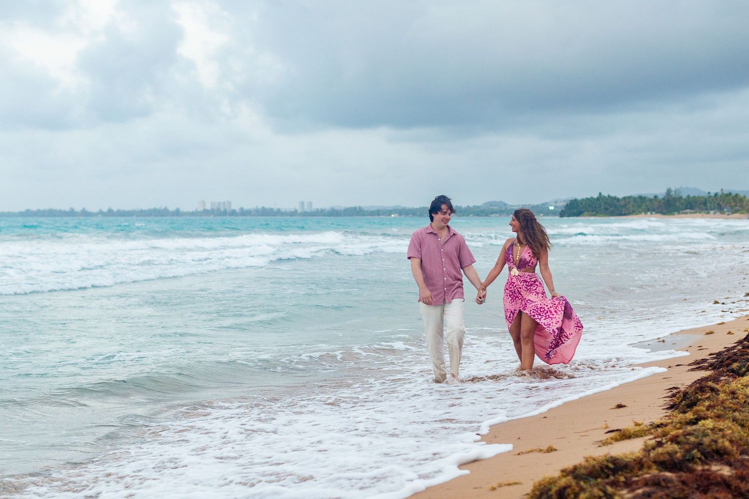 Couples portrait on the beach. Walking at the water's edge. Río Grande, Puerto Rico.
