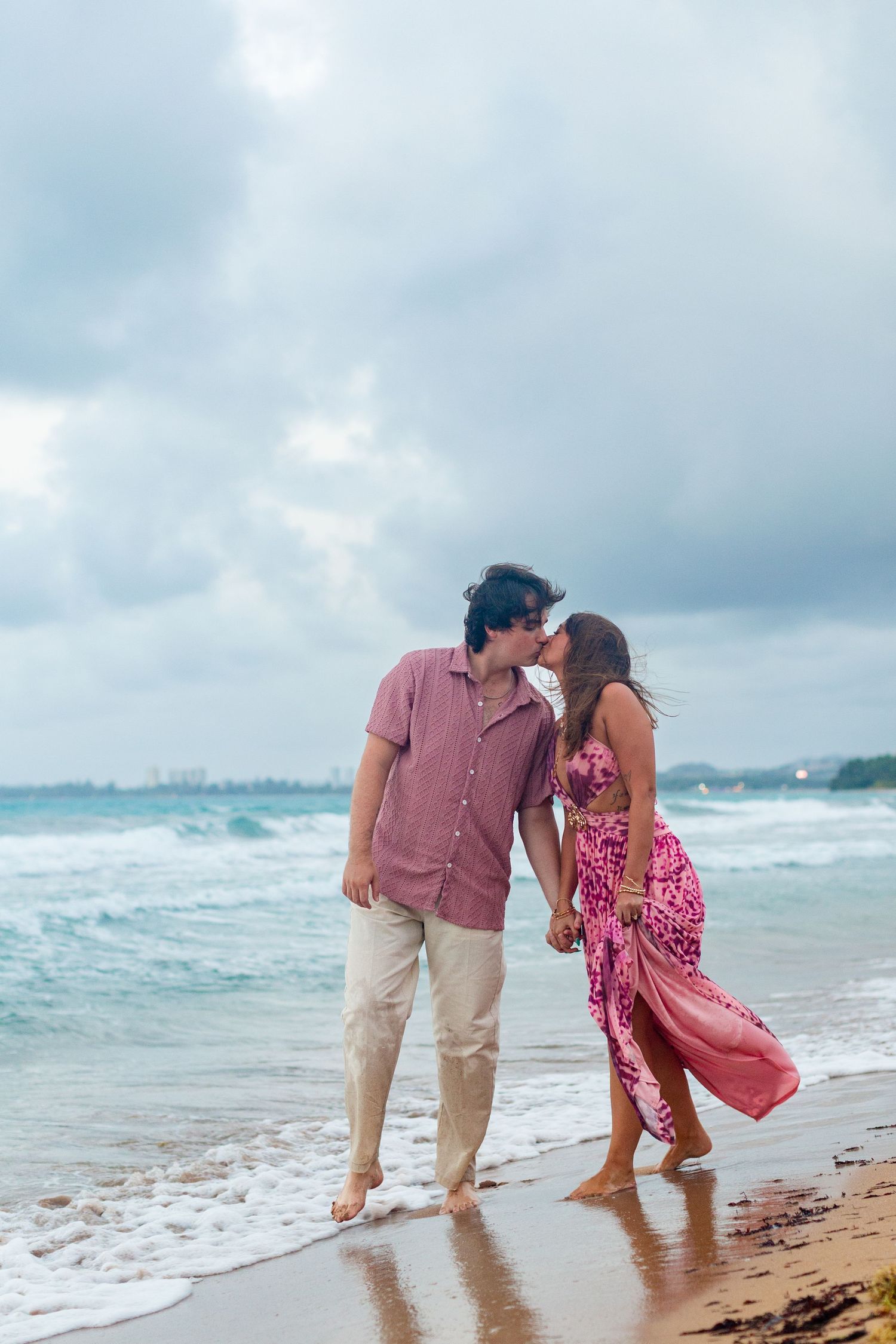 Couples portrait on the beach. Walking at the water's edge. Río Grande, Puerto Rico.