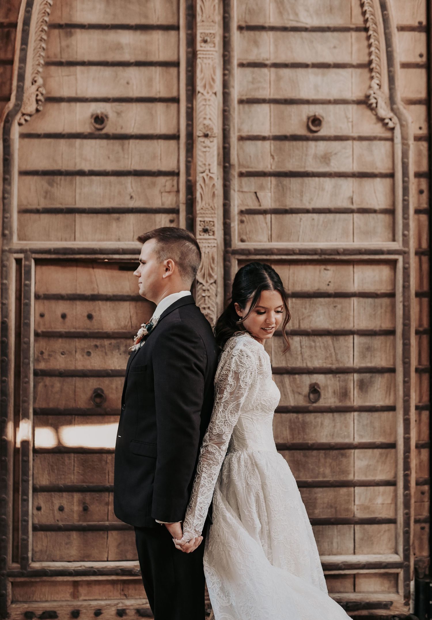 Bride and groom praying together before their wedding ceremony