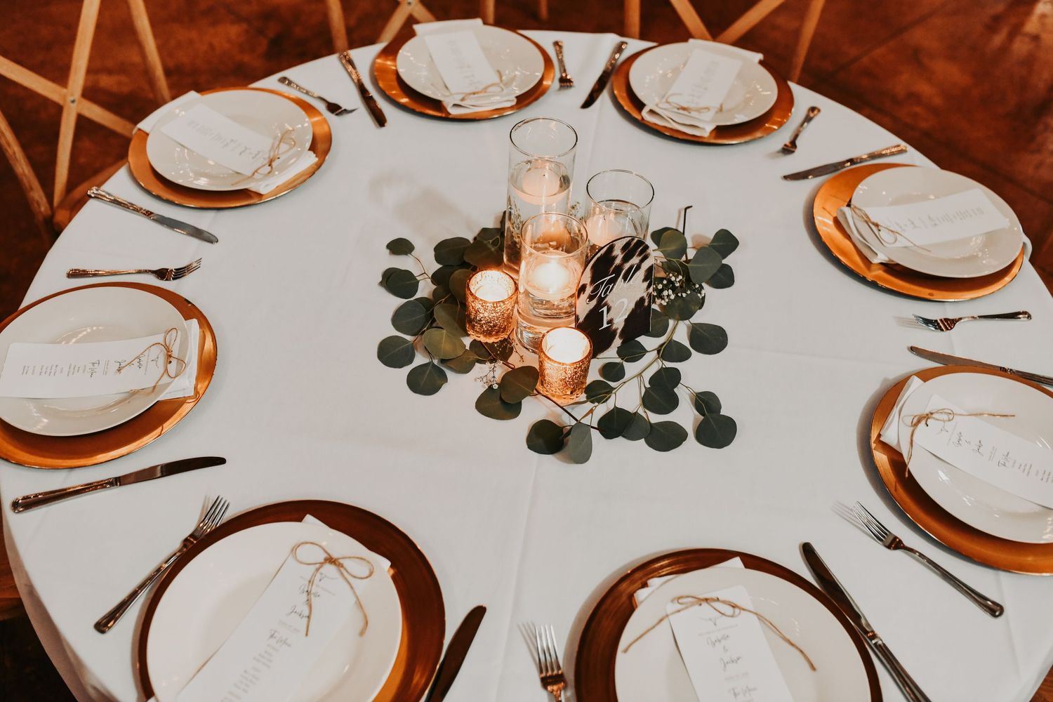 Gold wedding decor and organic greenery at Lucky Spur Ranch reception