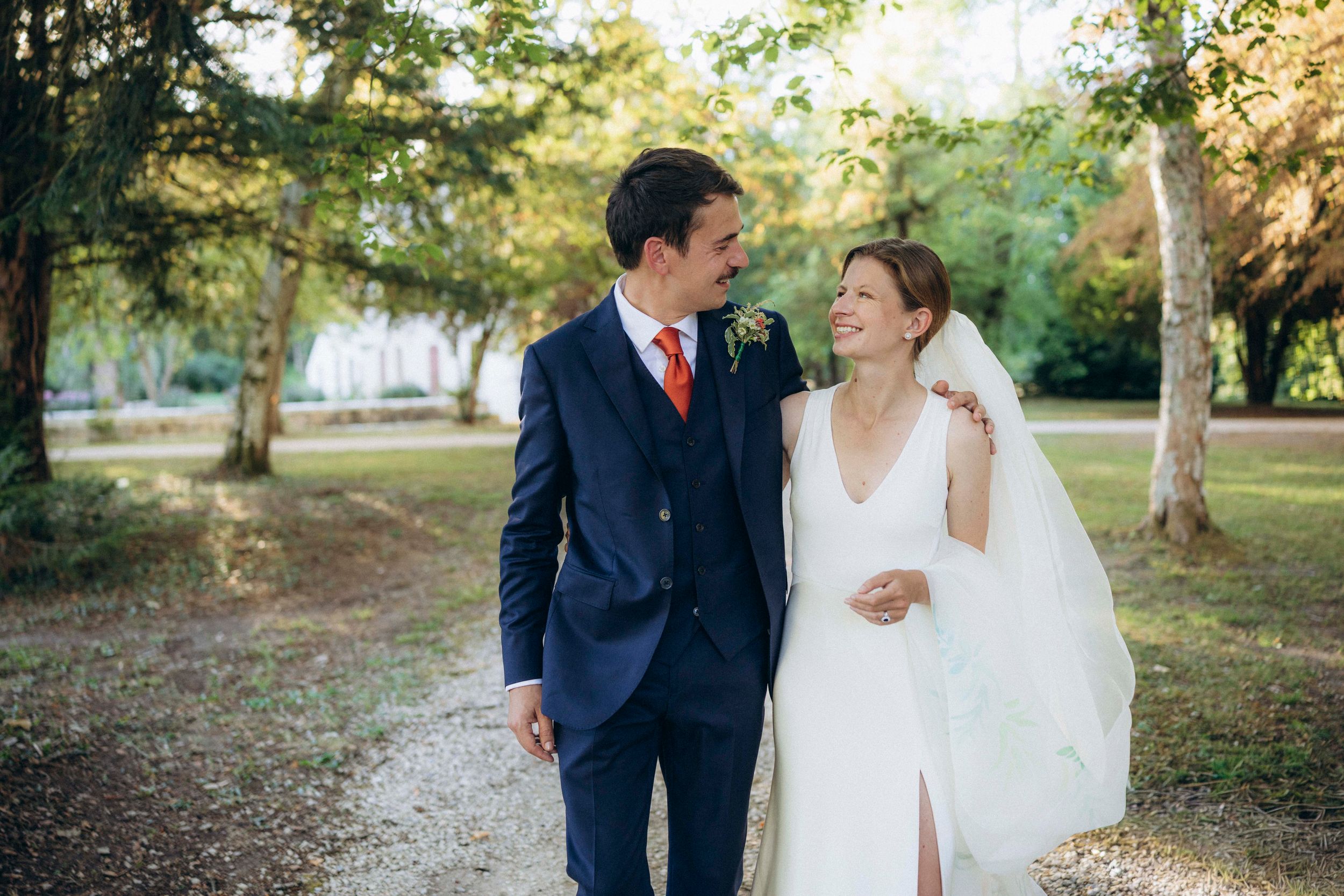 A romantic dance silhouette under stone archways with warm lighting.