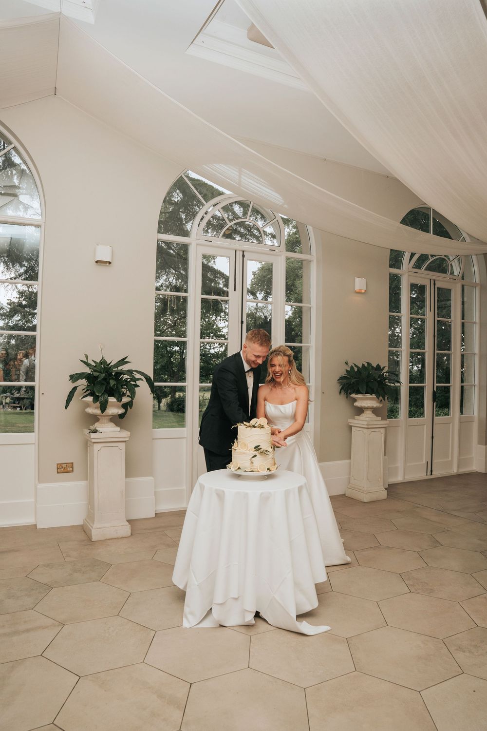 Bride and Groom cutting their cake at Deer Park in Devon