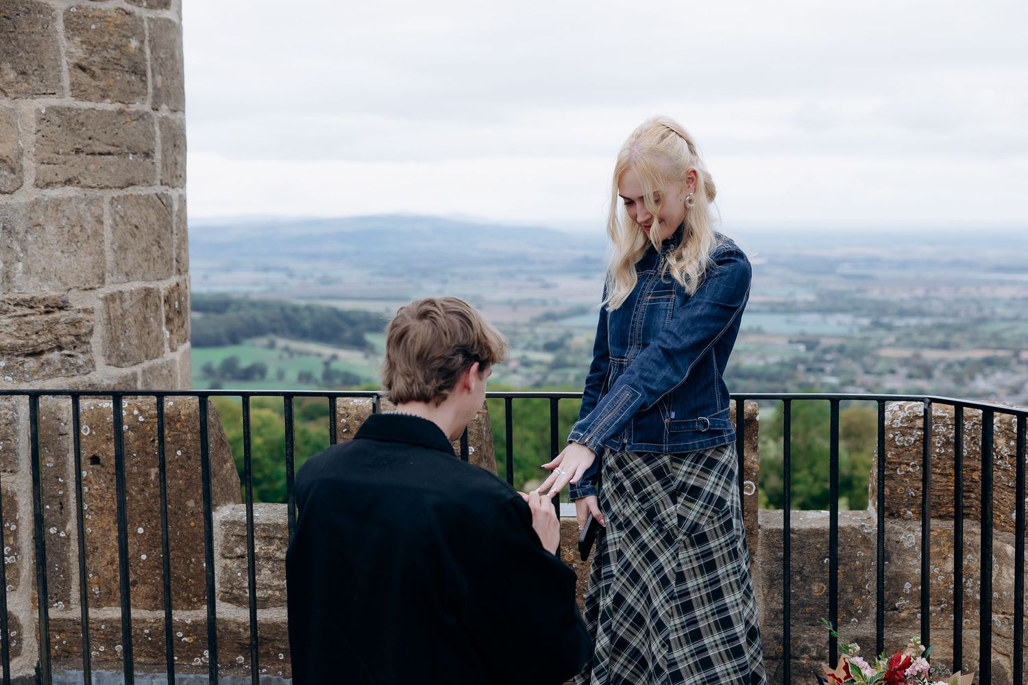 Couple celebrating their engagement at Broadway Tower.