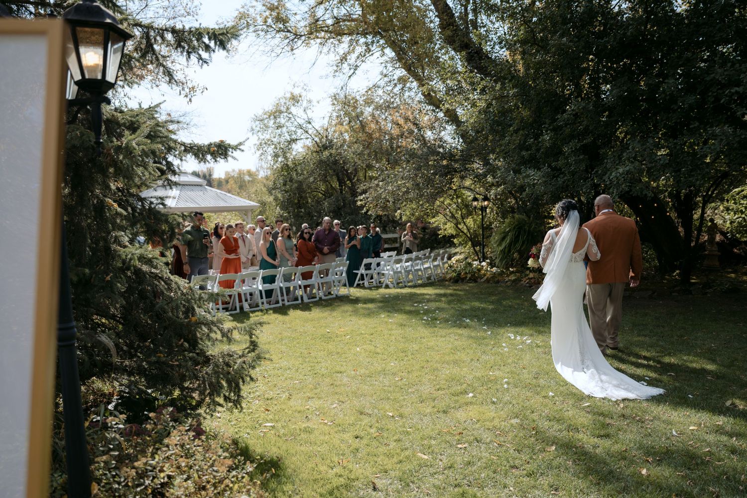 The Bride and her dad walk down the aisle during an intimate ceremony at Trellis Weddings in Stillwater, MN.