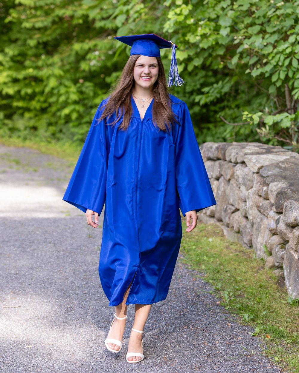 Lincoln Sudbury graduate poses in graduation dress for individual senior portrait during cap & gown. Weston High, Wayland, Framingham MA.