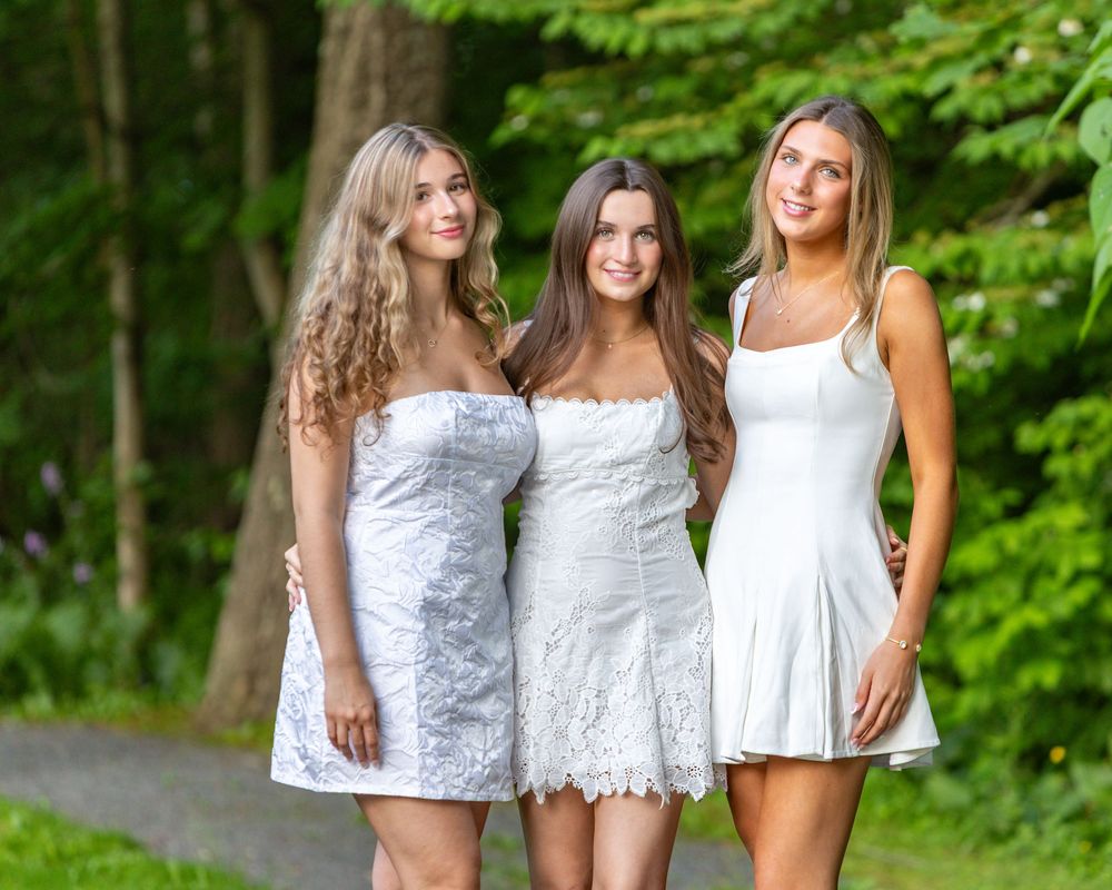 Lincoln Sudbury graduate friends pose together during cap & gown senior photos. Weston High, Wayland, Natick, Nashoba Regional High School.