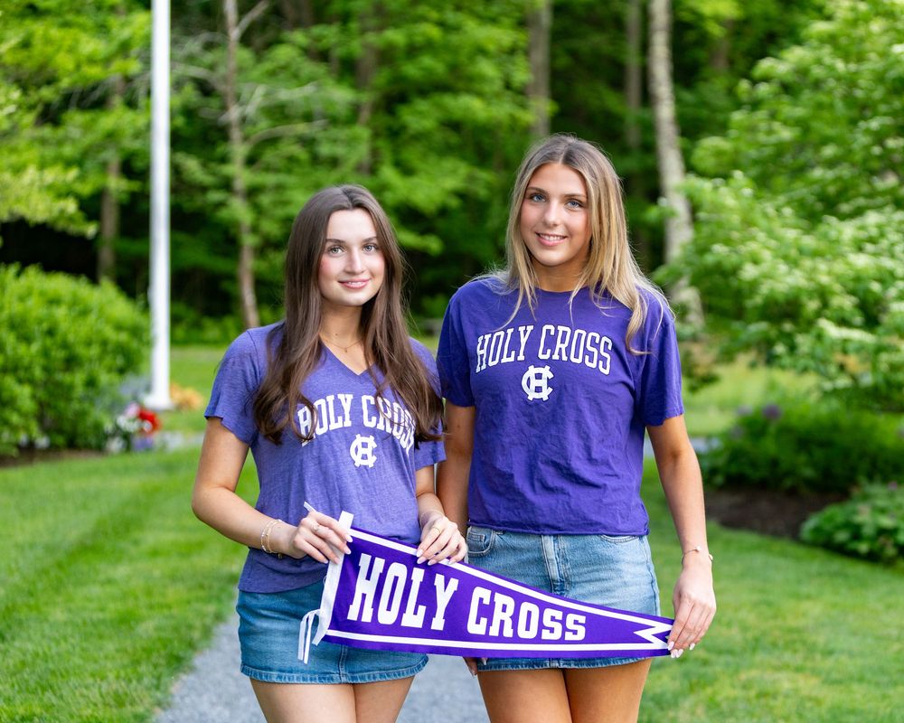 HS graduates pose during their cap & gown session in their future college tshirts & pennants.  Weston high school, Wayland, Lincoln Sudbury