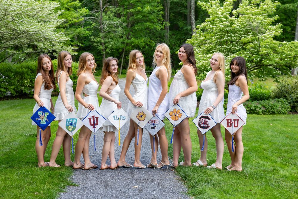 Lincoln Sudbury graduates hold their decorated mortar boards during cap & gown senior portraits. Weston High, Wayland, Concord Carlisle