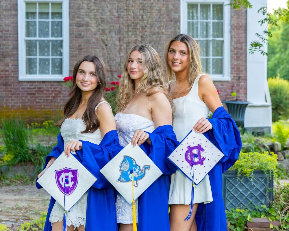 Lincoln Sudbury graduates hold their decorated mortar boards during cap & gown senior portraits. Weston High, Wayland, Concord Carlisle