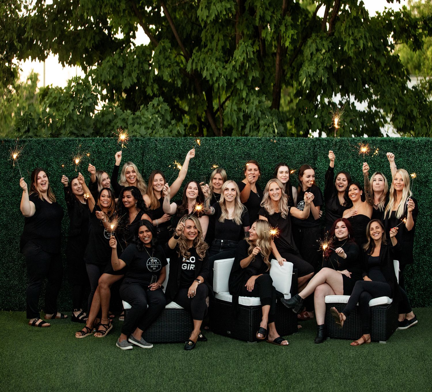 Meet the Team at Glow Day Spa. Fun exciting photo of team members and service providers outside celebrating.