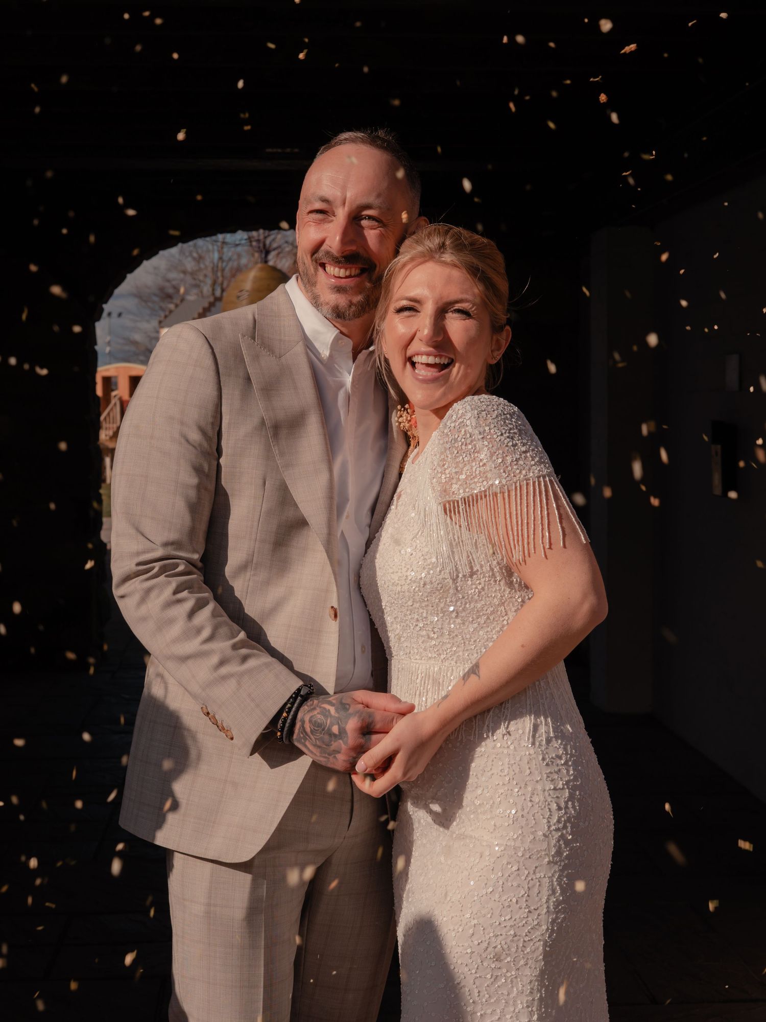 portrait of bride and groom during confetti toss at Gretna green photographed by Scottish Elopement photographer