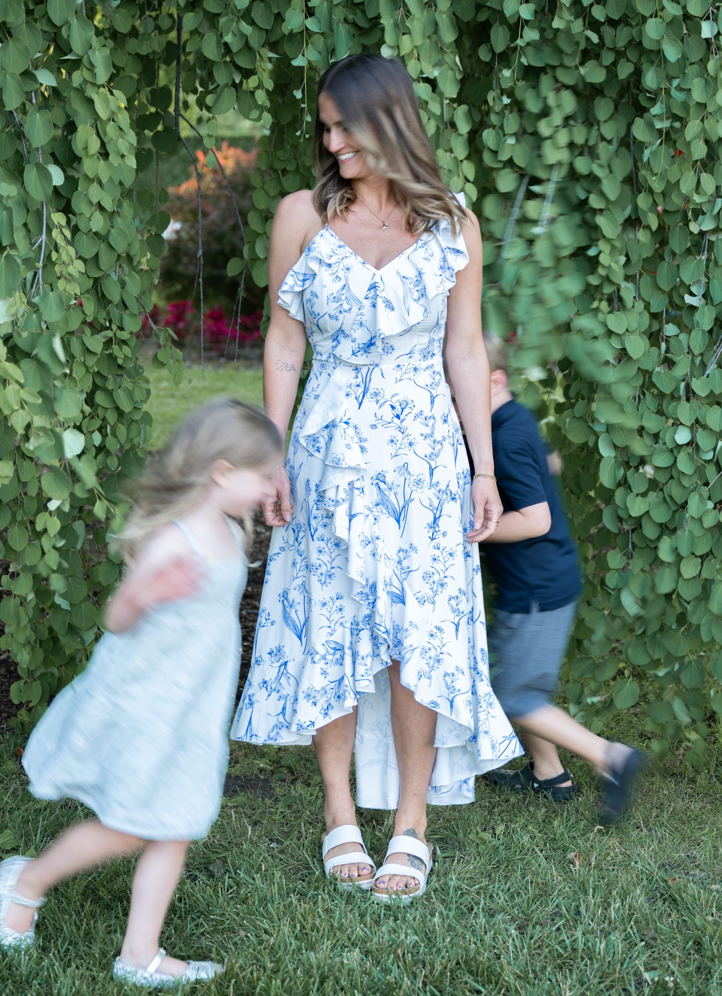 Children running around their mom.
