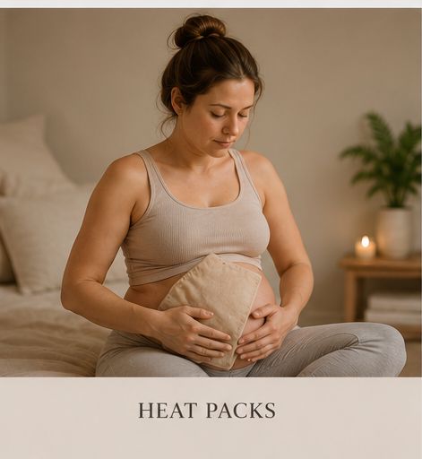 Pregnant woman using a warm heat pack for comfort during labour
