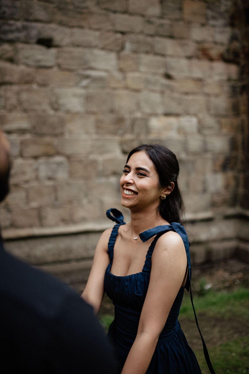 Joyful reactions during a surprise outdoor proposal moment.