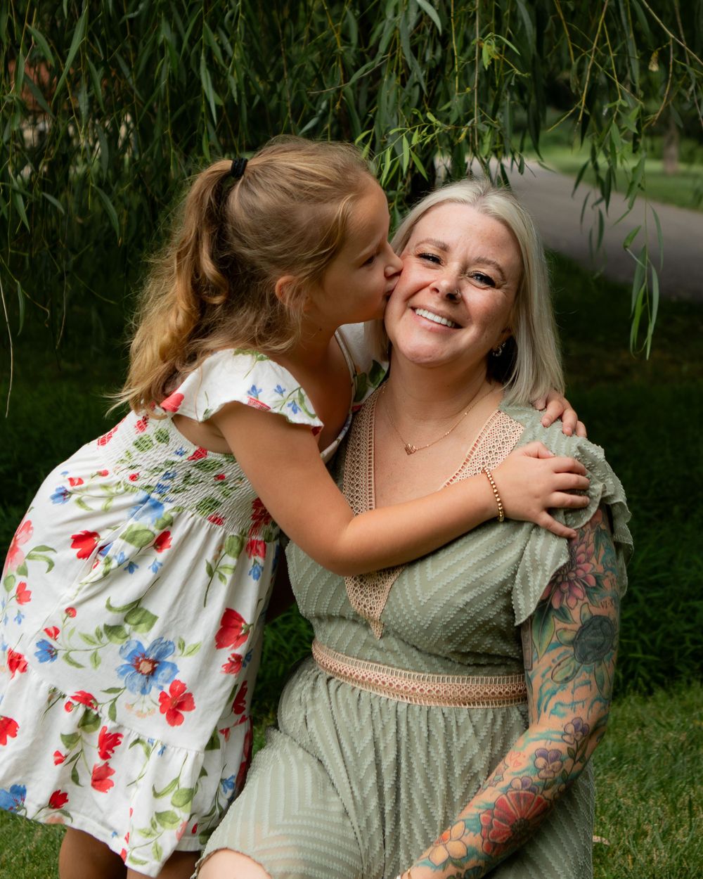 daughter kisses mom on cheek in strongsville.