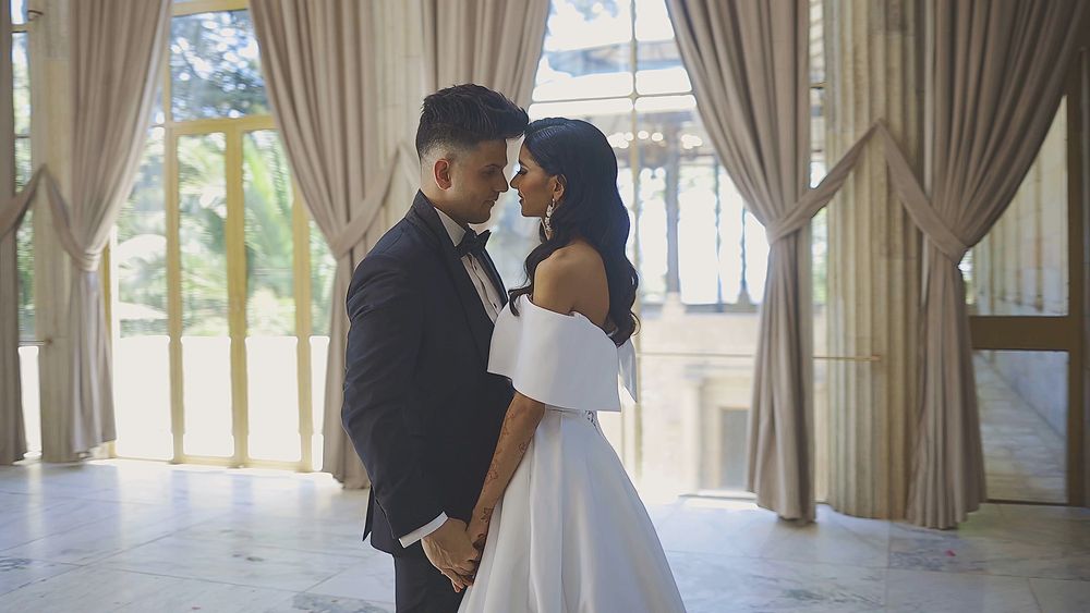 Elegant editorial-style portrait of newlyweds at their wedding venue.
