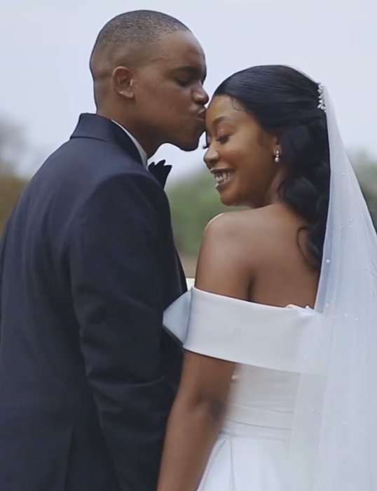 Newlyweds laughing together during their relaxed wedding portrait session
