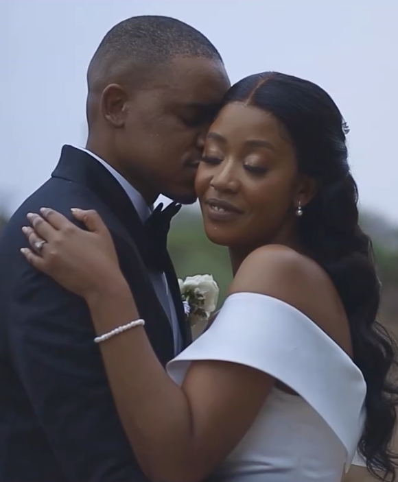 Elegant editorial-style portrait of newlyweds at their wedding venue.