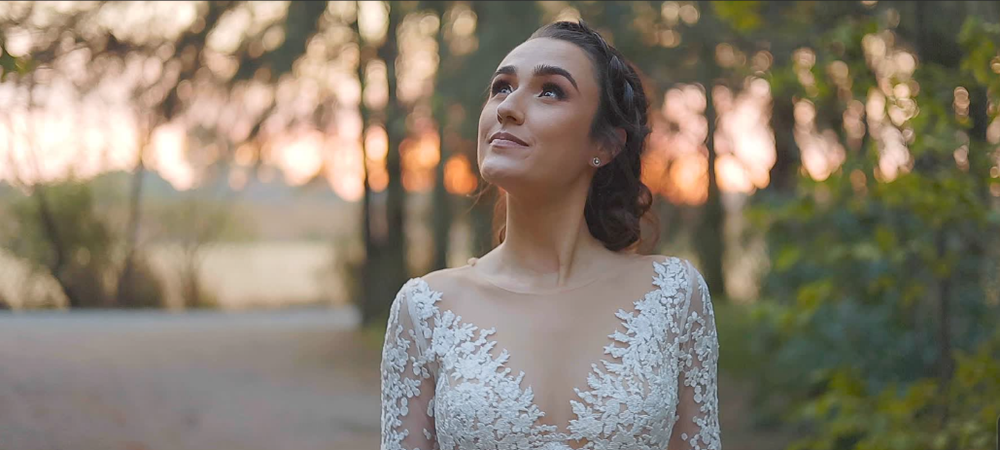 Bride seeing herself in her wedding dress for the first time.