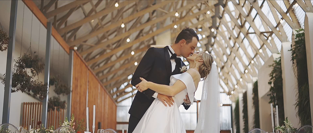 Emotional bride reacting during a heartfelt moment on her wedding day.