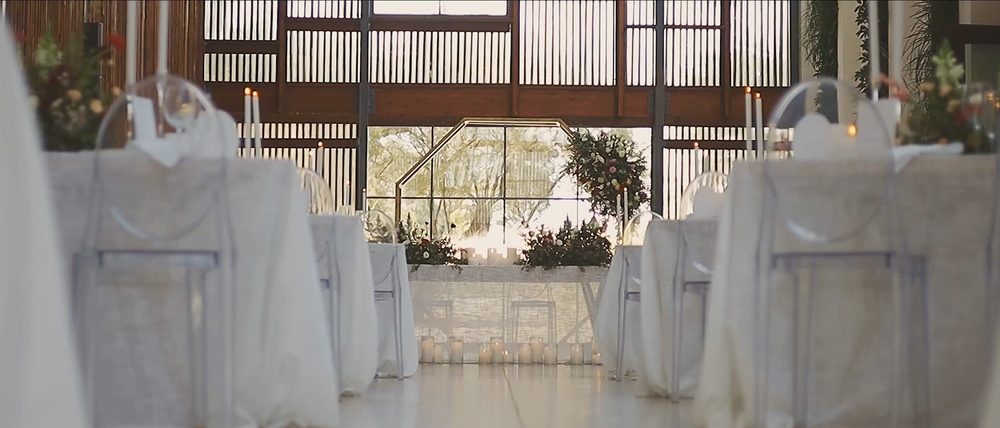 Reception venue interior featuring floral décor and personalised details.