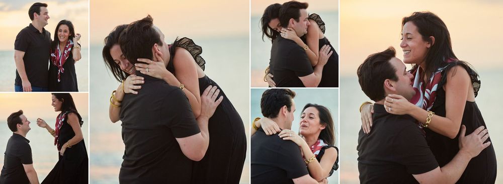 Couple sharing tender embrace and kiss on beach during golden hour engagement.