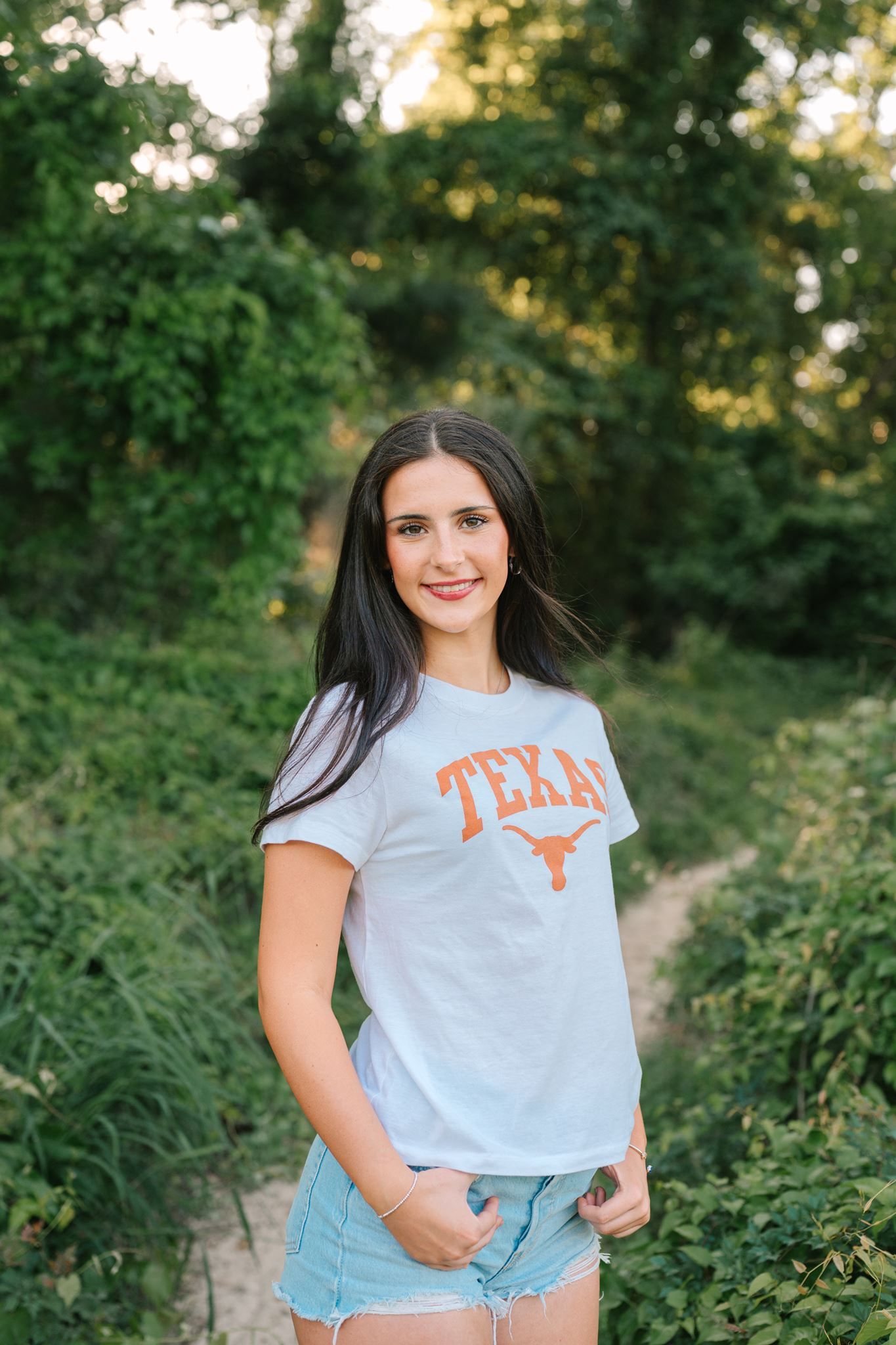 The Woodlands College Park senior girl posing on sand at Pundt Park in Spring Texas.