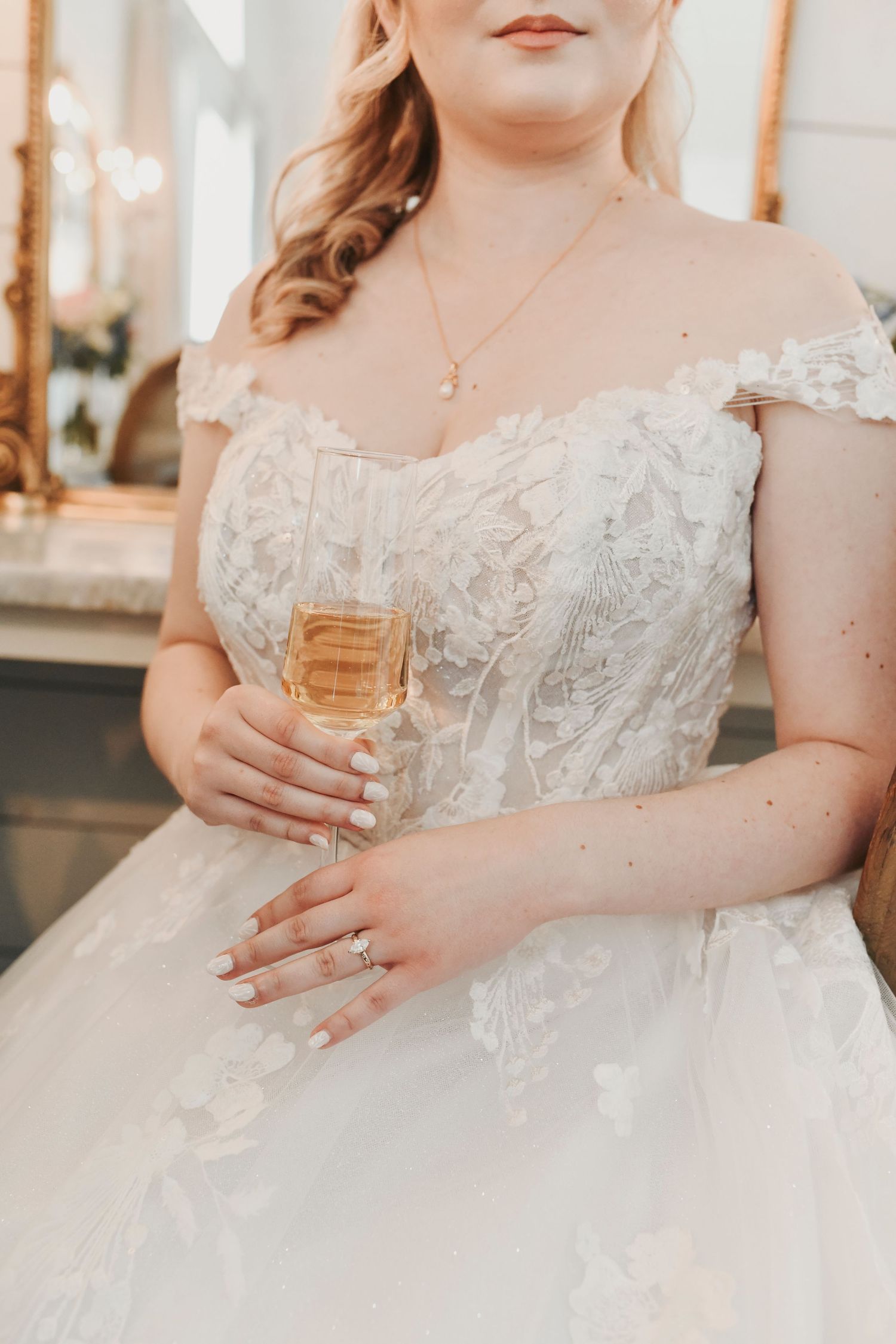 Kathryn getting ready for her romantic pastel wedding at The French Farmhouse