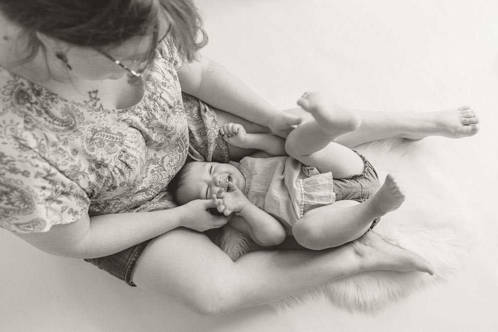 Tickle time during milestone session in Tyler Texas by Motherhood Photographer KP Portraits who has been Documenting children for 20+ years