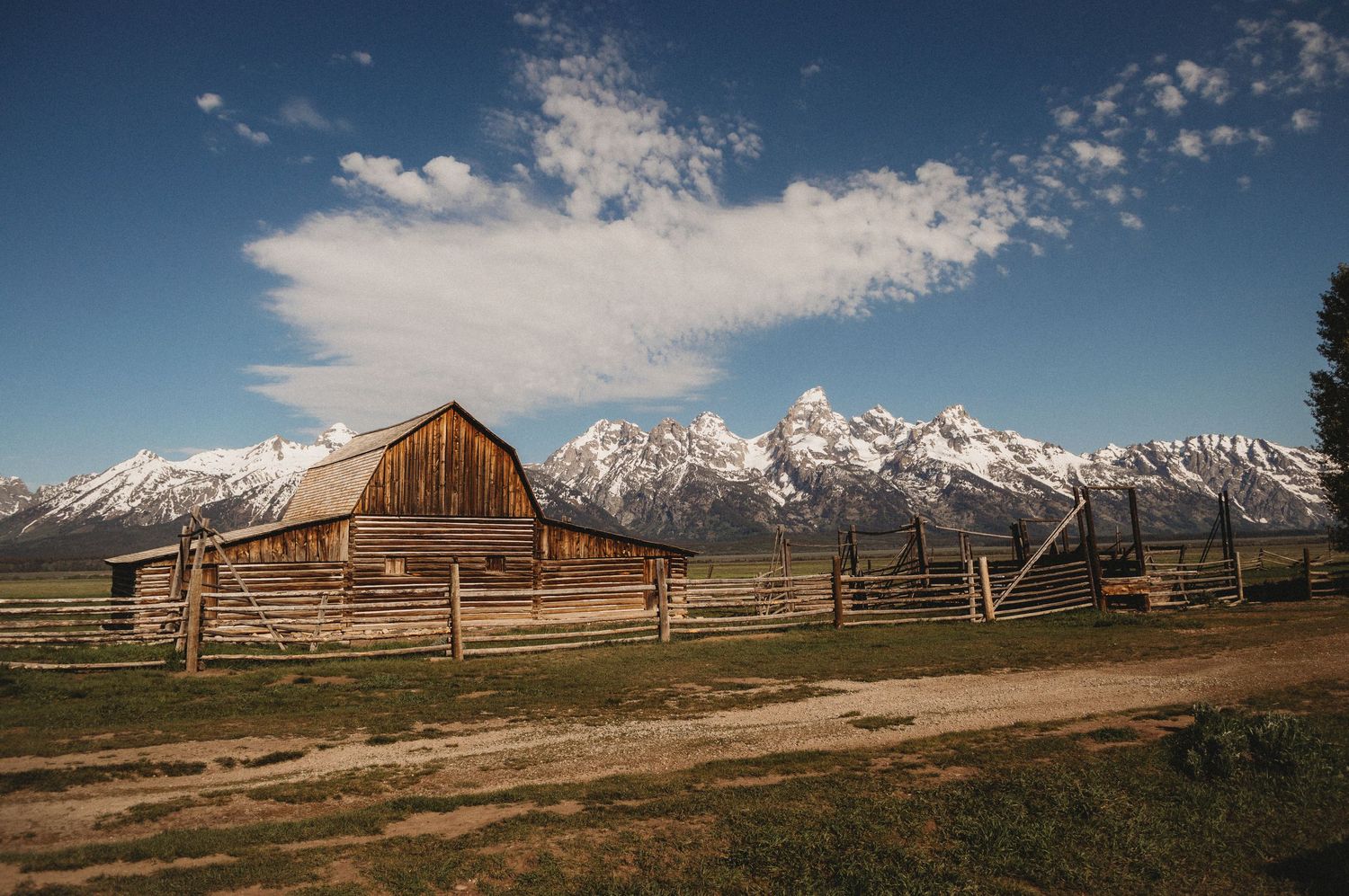 Barn in foreground with the Grand Tetons in the background