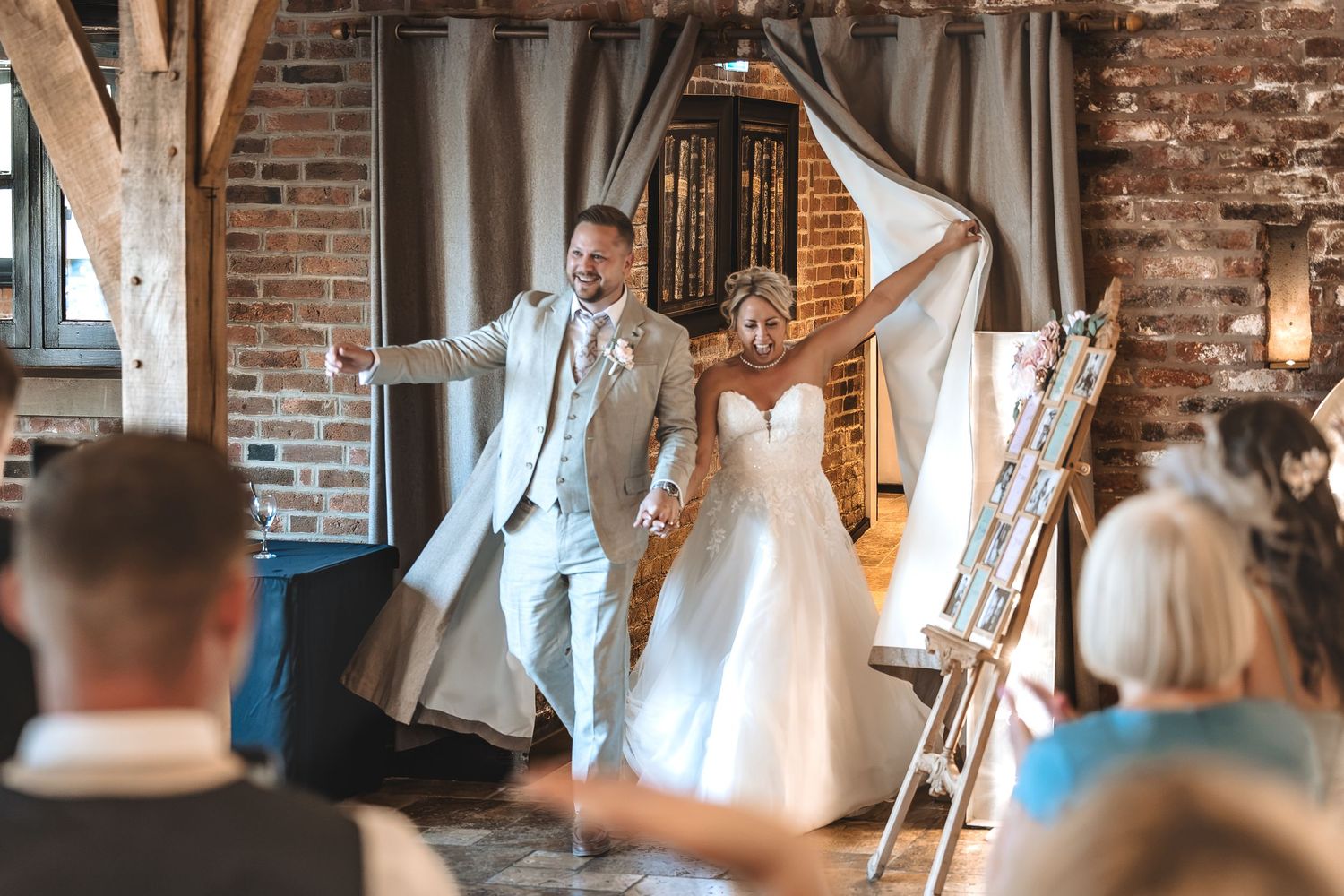 Bride and groom making their wedding breakfast entrance at Swancar Farm