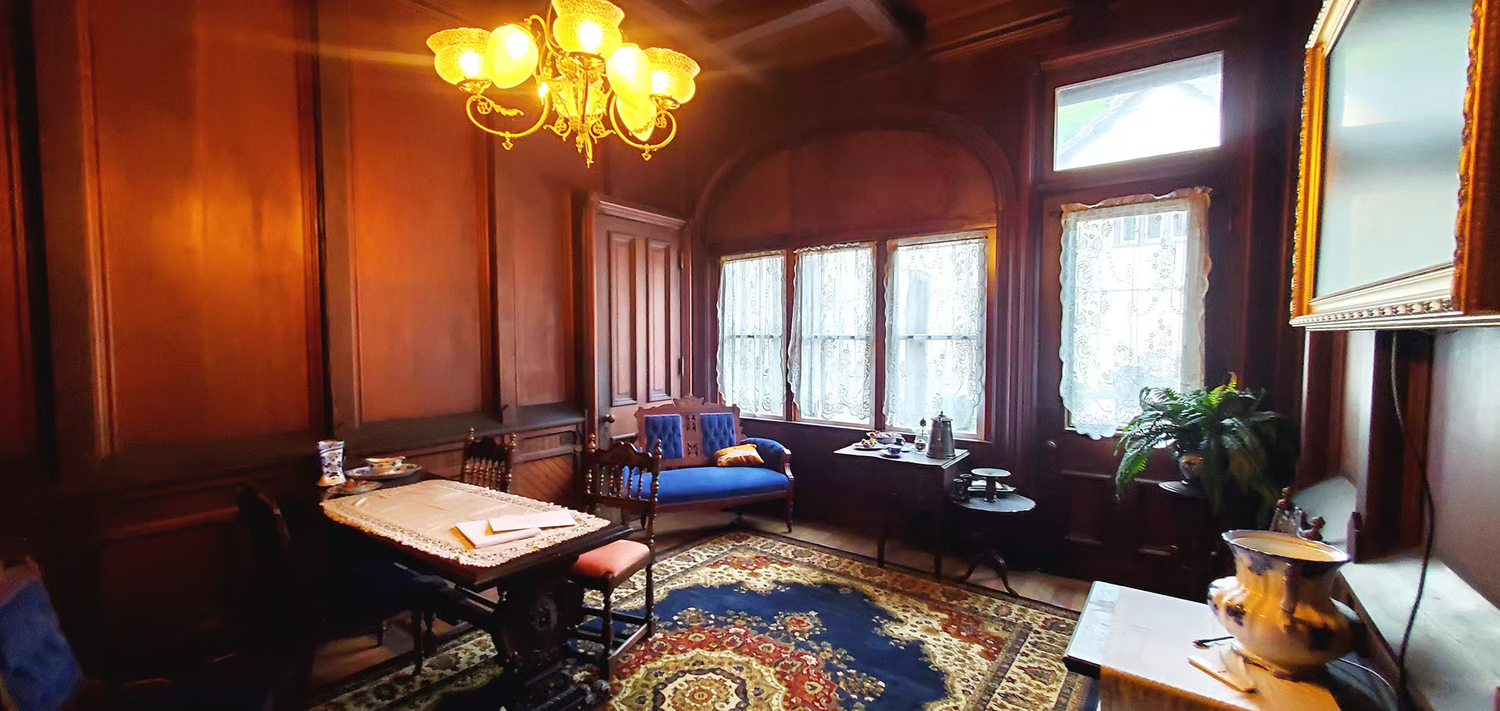 mac-o-chee wedding Elegant wood-paneled study with chandelier,