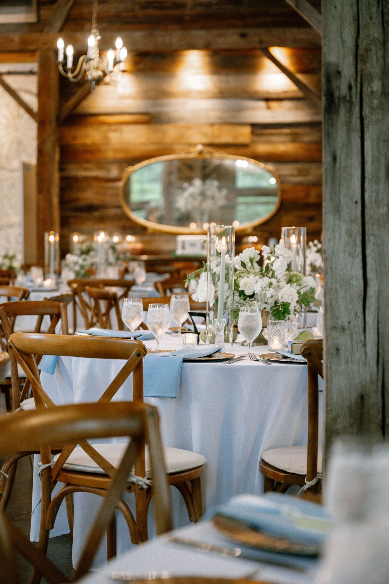 White, blue and green reception table scape at Historic Hill House wedding venue in Willis Texas.