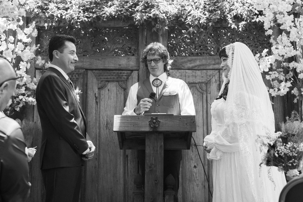black and white wedding photos show couple exchange vows