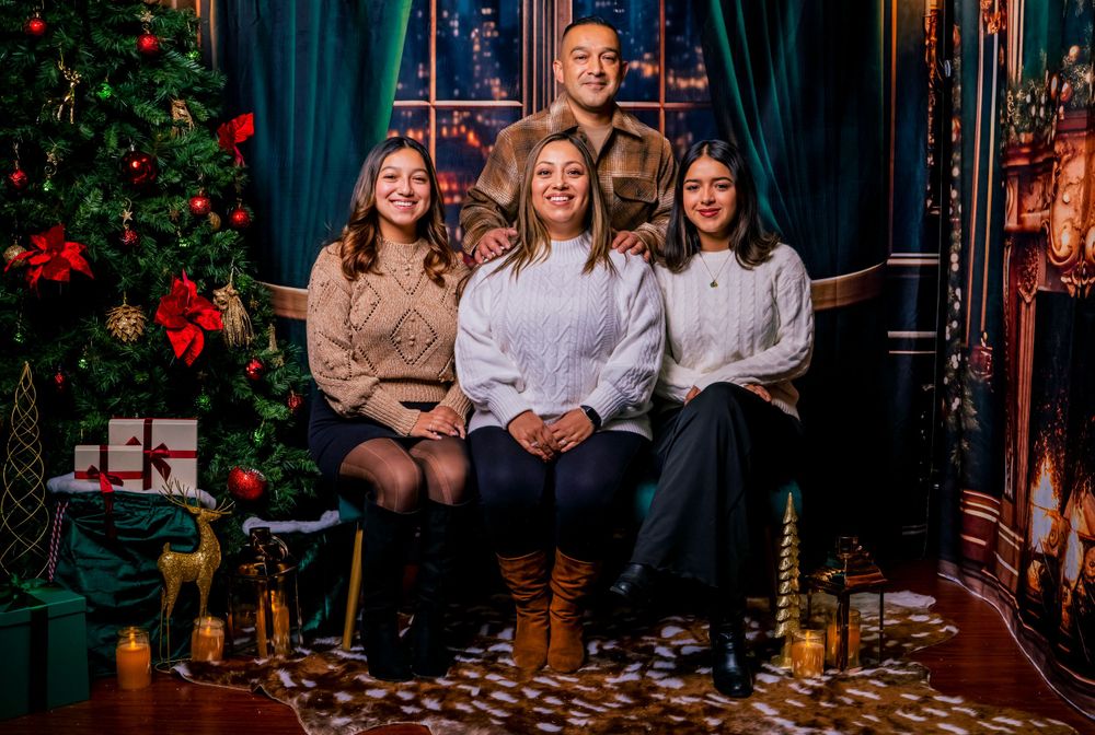 Holiday portrait with Christmas tree and festive decorations in elegant indoor setting. north hollywood.