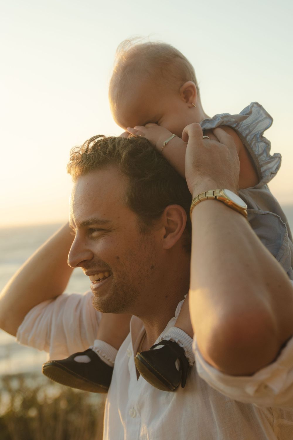 family kissing during photo shoot by SoCal photographer