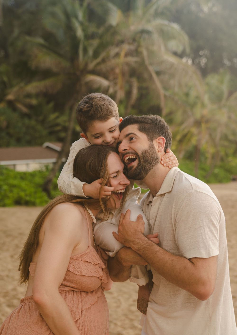 family laughing during kauai photo shoot by kauai photographer