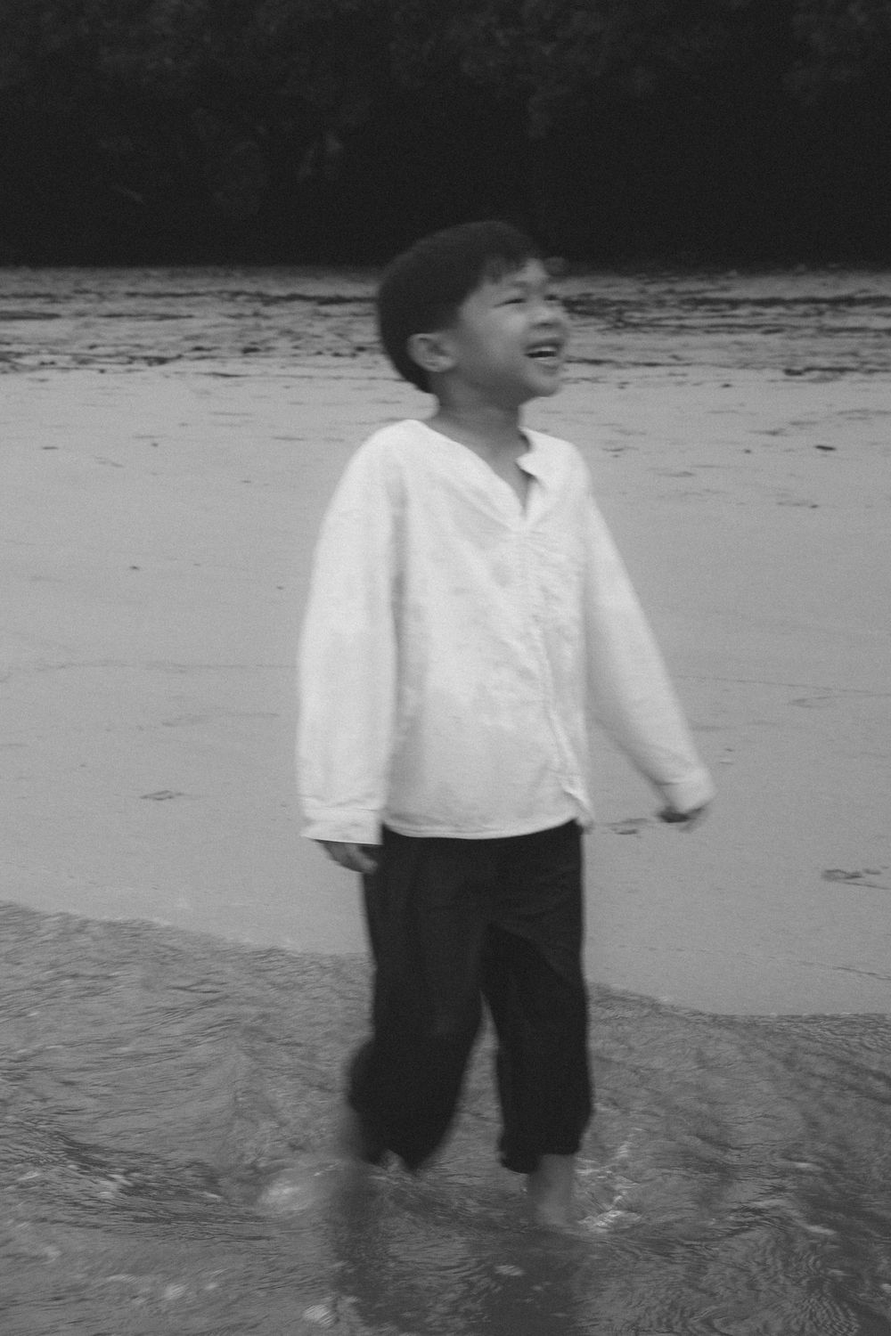 kid laughing during kauai photo shoot by kauai photographer