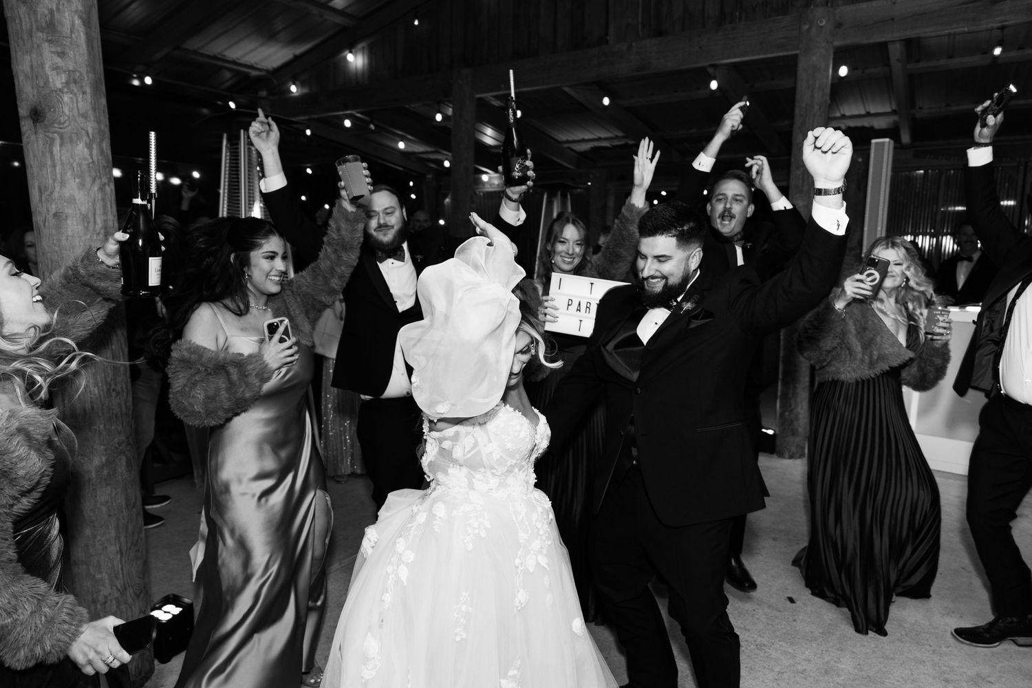 Bride and groom enter their reception at La Venture Grove wedding venue and celebrate with their closest friends and family.