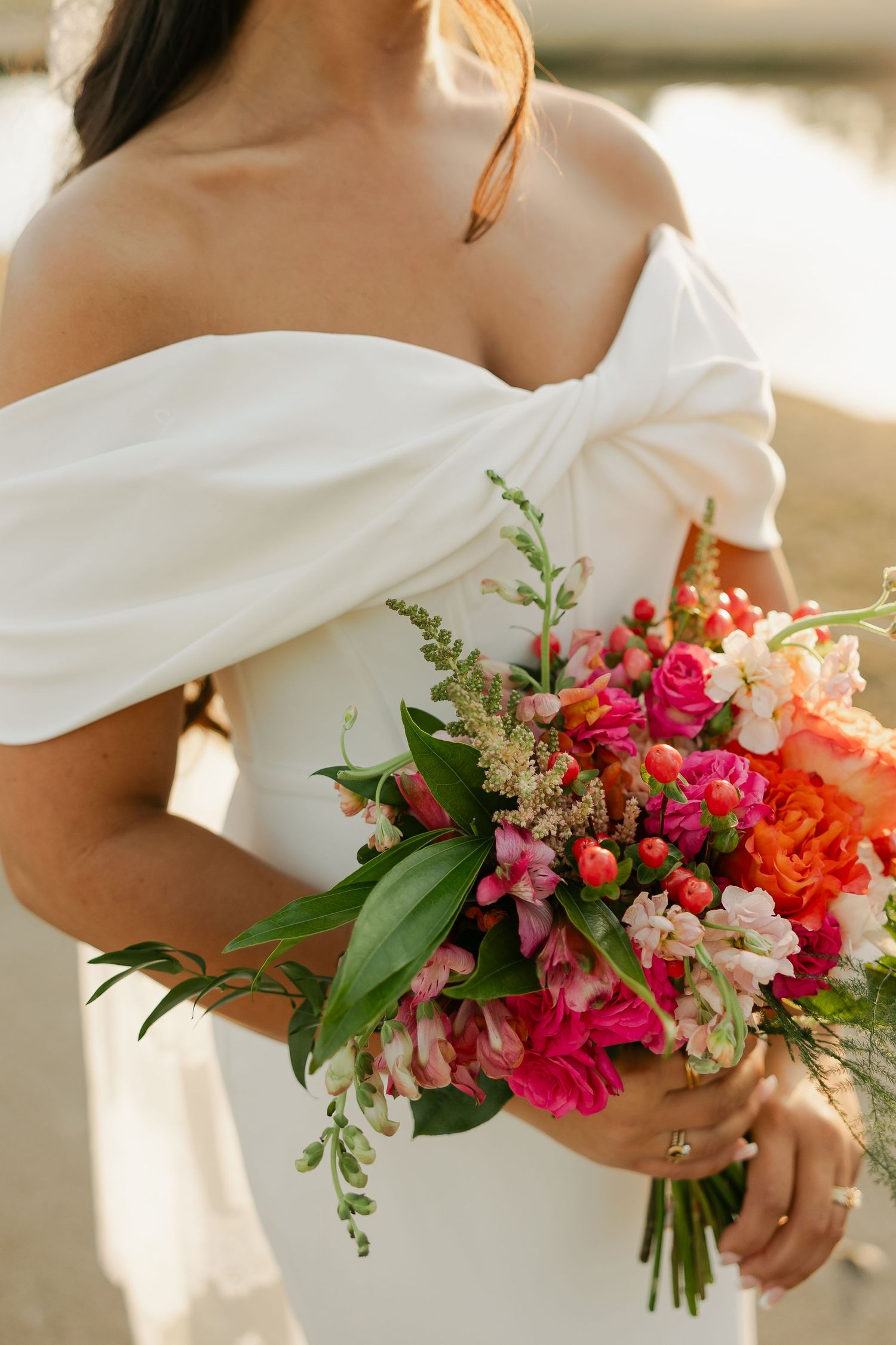 Bride's colorful bouquet with a mix of so many different florals at Eagle Harbor Golf Club.