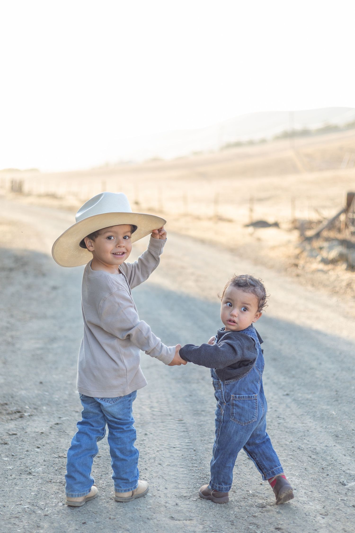 Heartwarming scene of a family, such as parents and children, smiling and laughing together, captured in a natural light setting with a clea